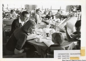 ["Governor Jay Rockefeller, his wife Sharon, and their kids deciding on food to order at Blackwater Falls Lodge."]%